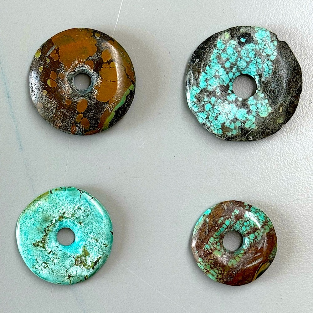4 Turquoise donuts for jewelry or crafts.